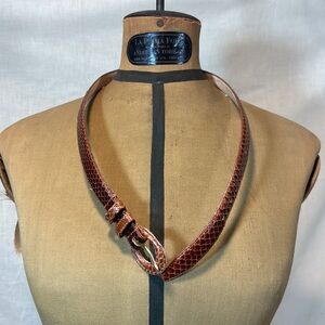 Snakeskin women’s size small belts.